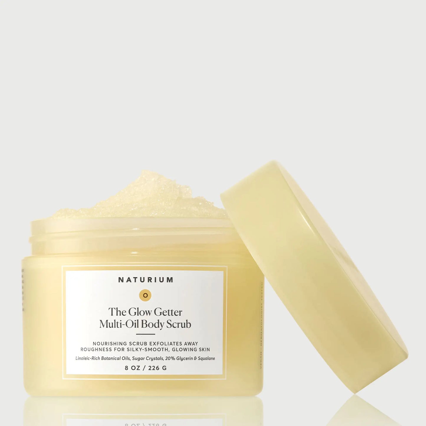 the-glow-getter-multi-oil-body-scrub-o6 NATR-40028-GlowGetter-Multi-Oil-Body-Scrub-Front-CapOff-bonebkgd.webp