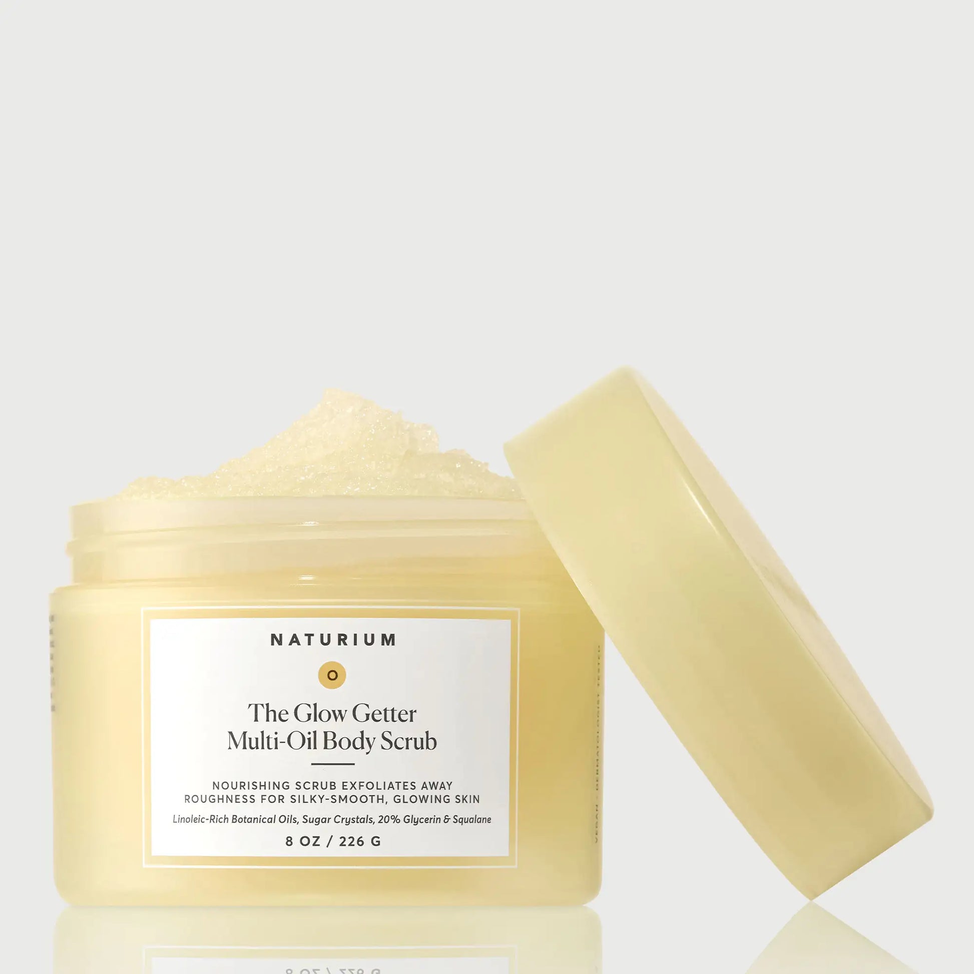 the-glow-getter-multi-oil-body-scrub-o6 NATR-40028-GlowGetter-Multi-Oil-Body-Scrub-Front-CapOff-bonebkgd.webp
